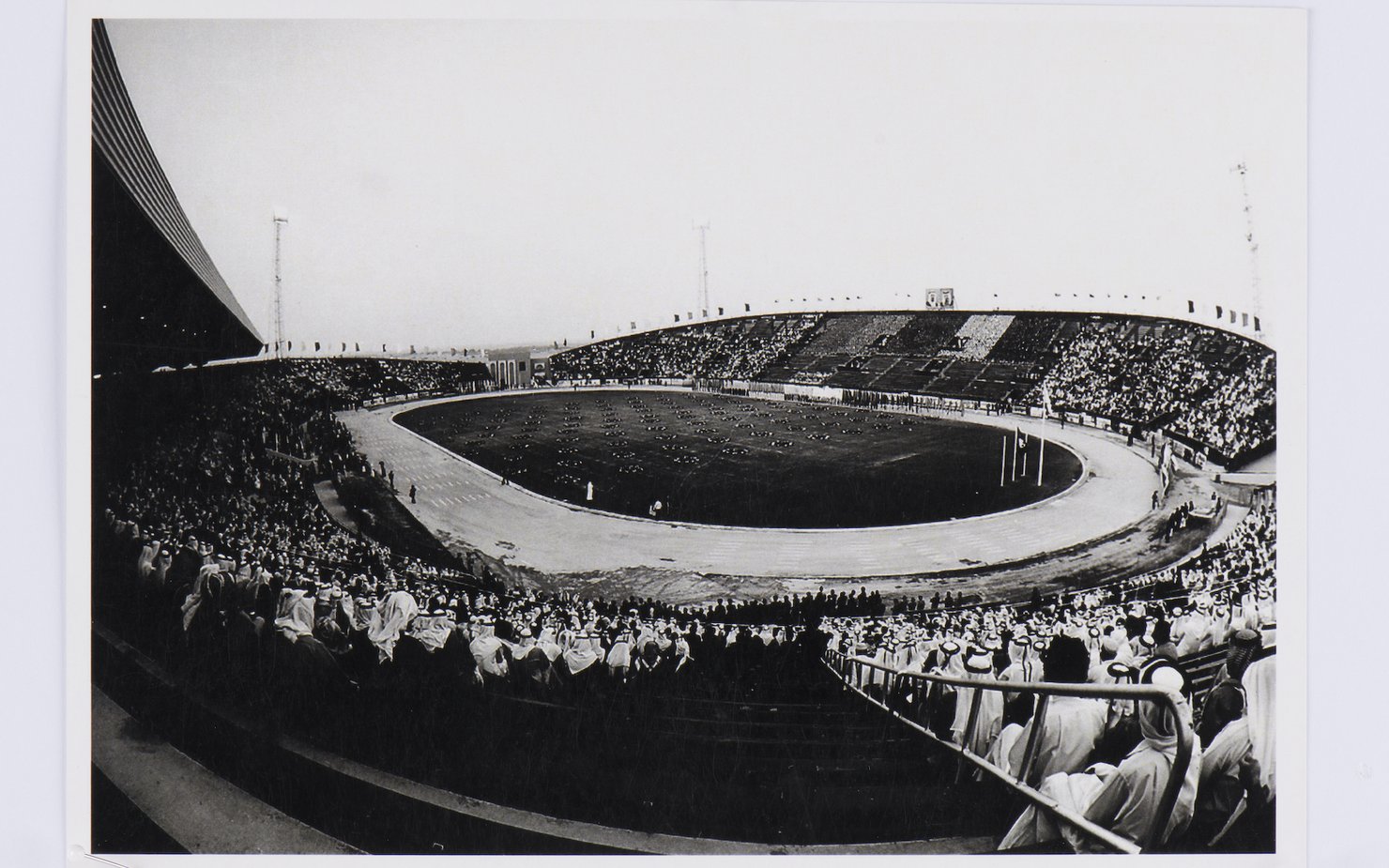 Black and white image of a stadium packed with spectators.