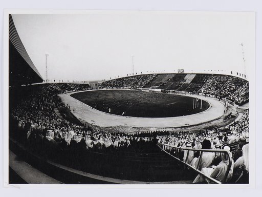 Black and white image of a stadium packed with spectators.