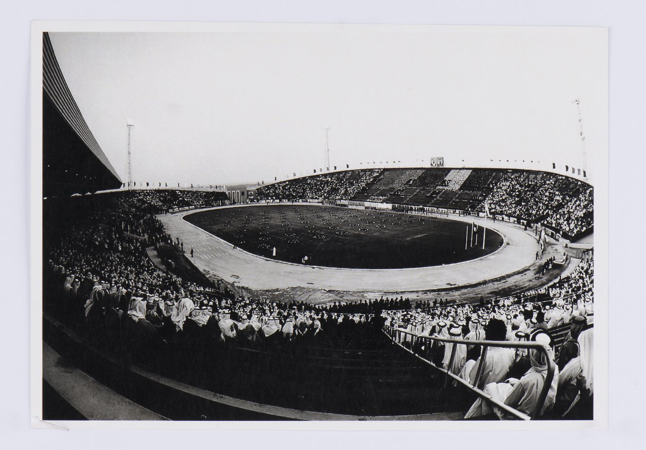 Black and white image of a stadium packed with spectators.