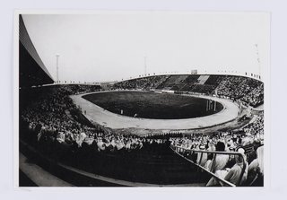 Black and white image of a stadium packed with spectators.