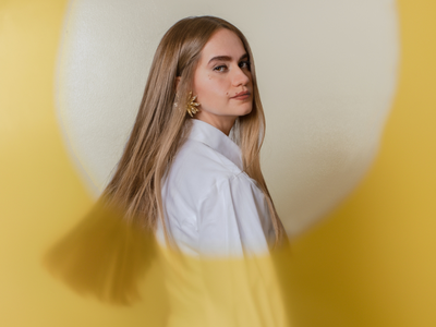 Woman blonde hair yellow circle