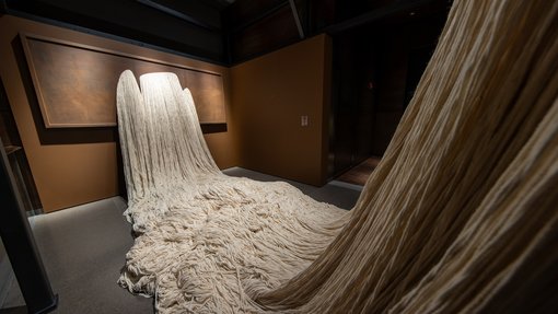 white threads on a wall
