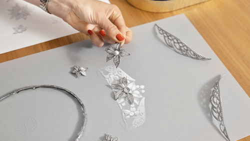 Hand holding a flower jewellery