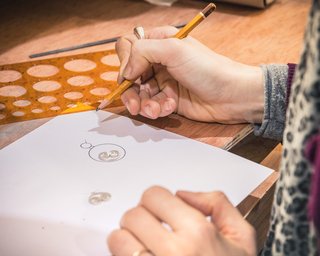 Person sketching on paper