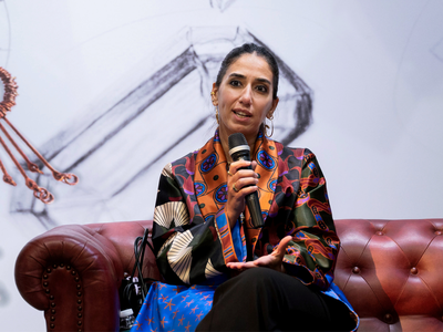 women speaking sitting in a couch