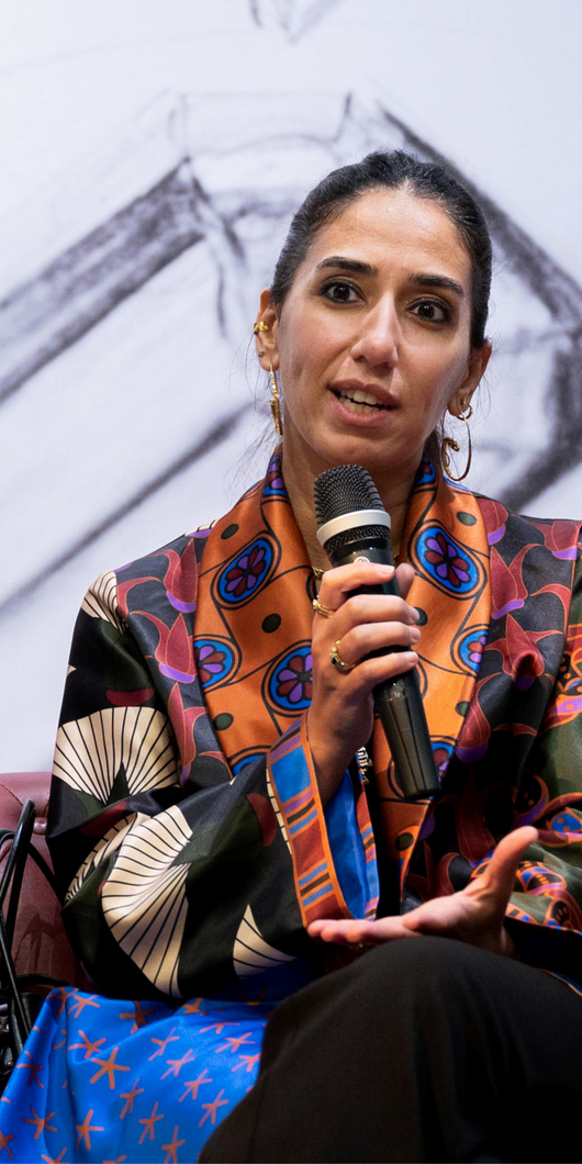 women speaking sitting in a couch