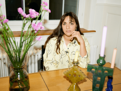 Woman posing at a table
