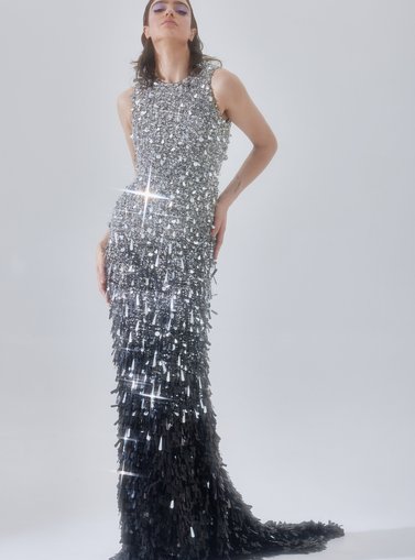 Model posing in a silver dress