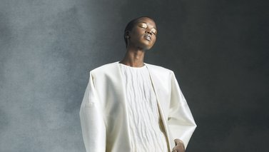 Model wearing a short white dress