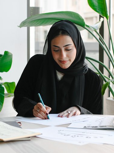 Woman sitting and sketching