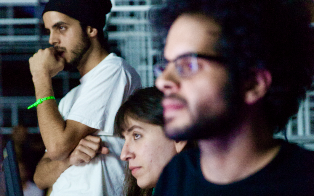 A group of young creative people, looking and listening attentively