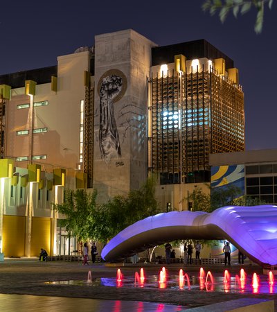 External view of Fire Station: Artist in Residence illuminated at night
