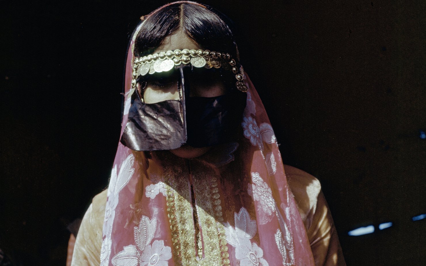 Woman wearing traditional Qatari dress and face covering