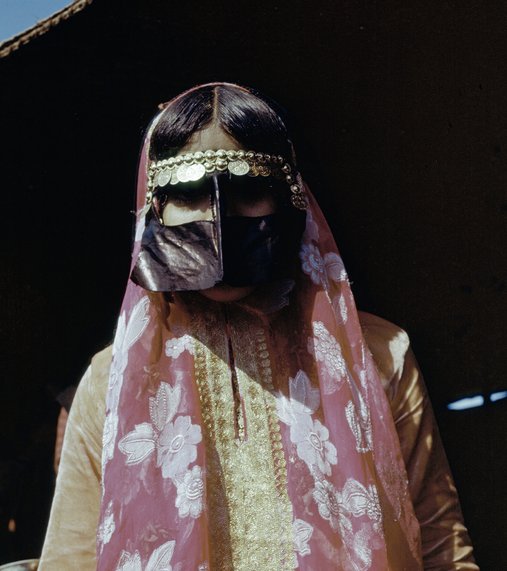 Woman wearing traditional Qatari dress and face covering