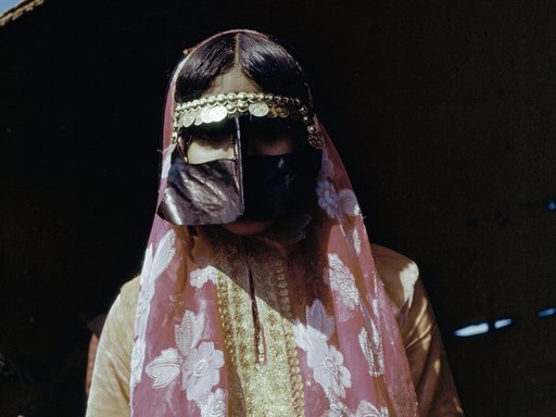 Woman wearing traditional Qatari dress and face covering