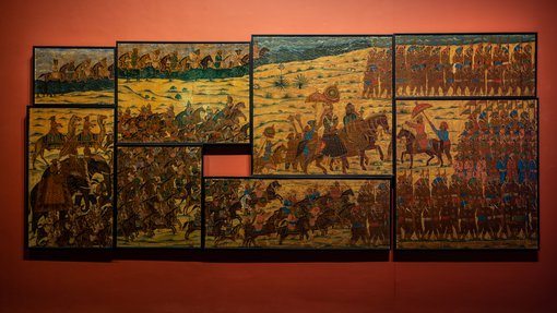 Eight paintings connected together, depicting war times at 'One Tiger or Another' exhibition
