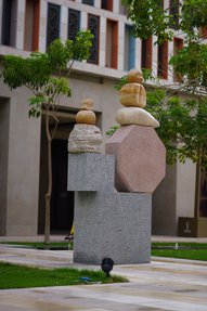 A large-scale geometric sculpture positioned in the center