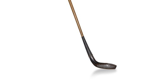 A golf putter with a silver club and a bronze handle.