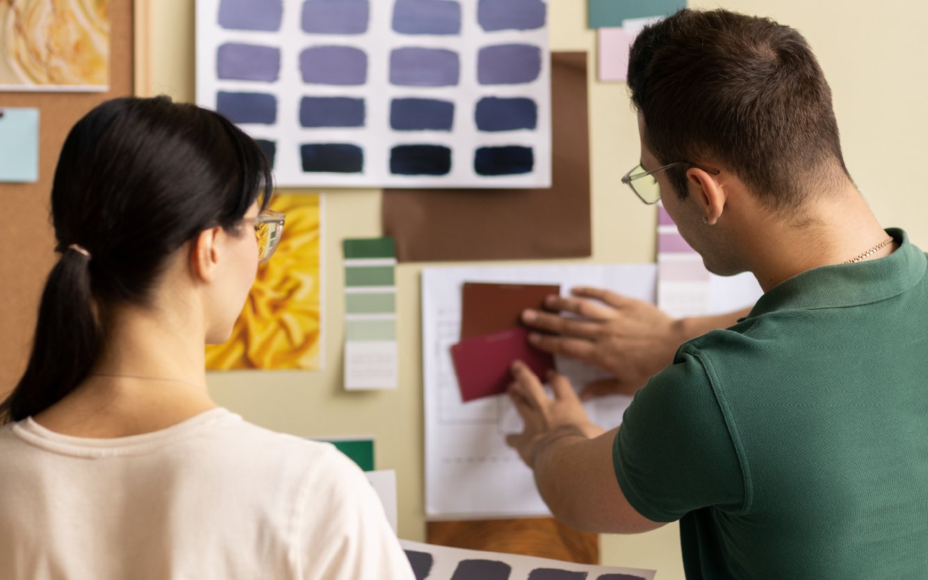 two people making a collage