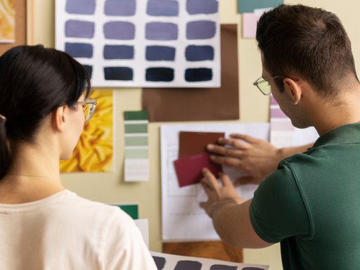 two people making a collage