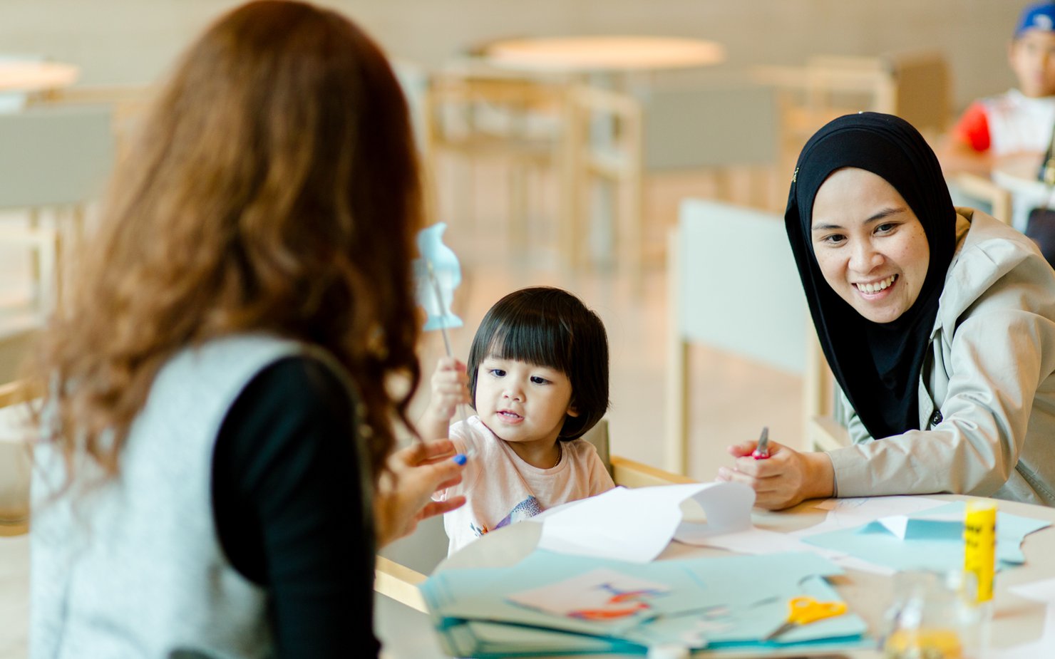 A mother and her child attend a workshop