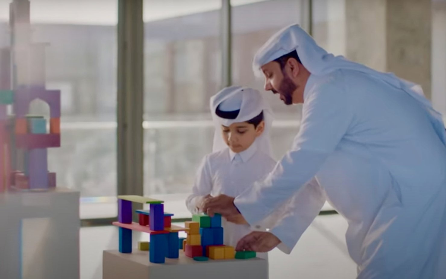 A Qatari father and son play at Dadu, Children's Museum of Qatar